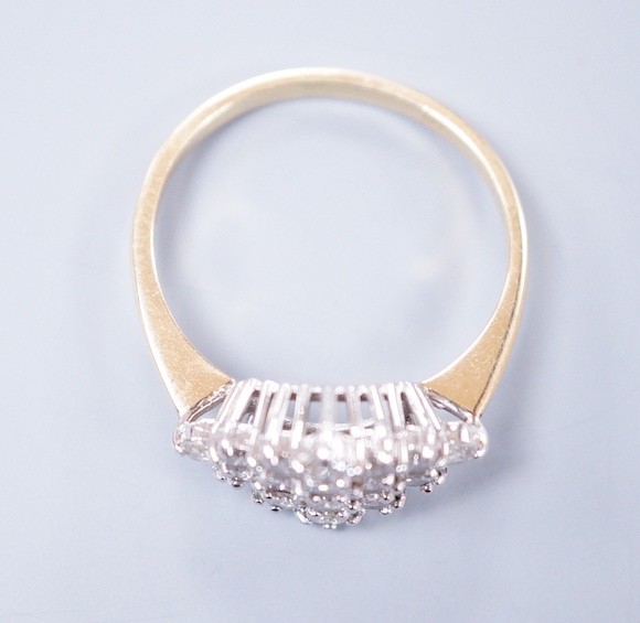 A modern 18ct gold and diamond set marquise shaped cluster ring, size M, gross weight 2.9 grams